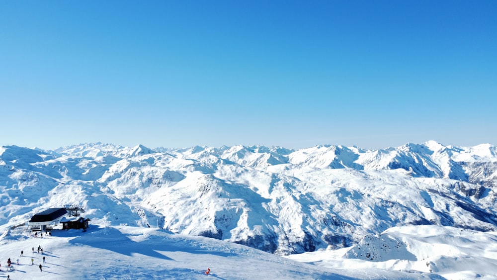 a view of a snowy mountain range from a ski slope