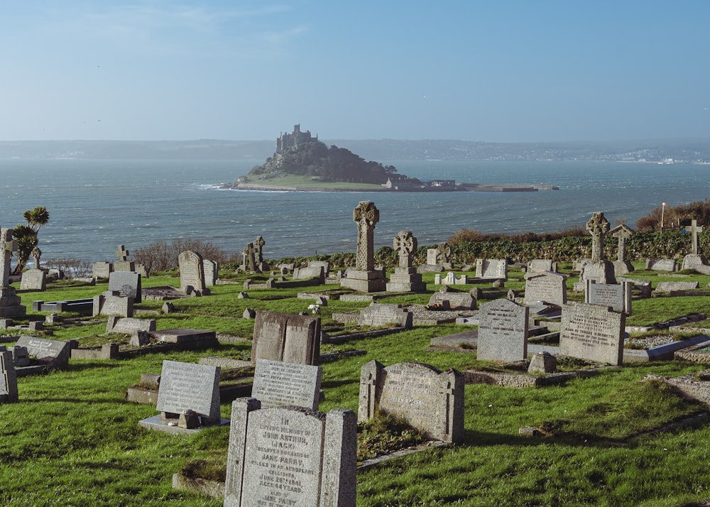 a cemetery with a small island in the background