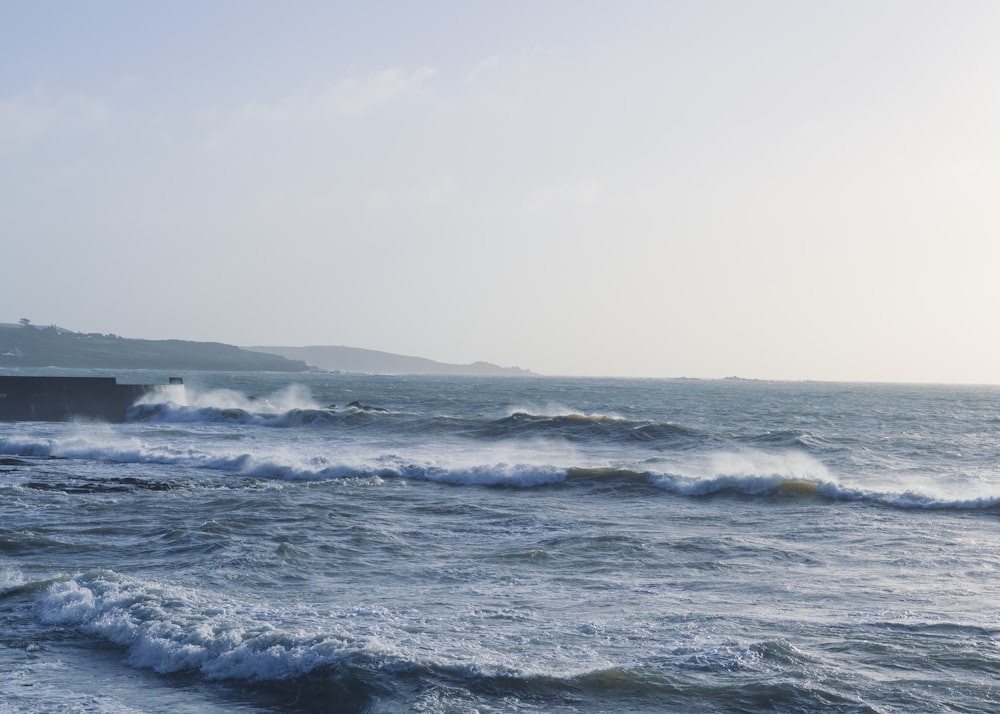 a large body of water with waves coming in to shore