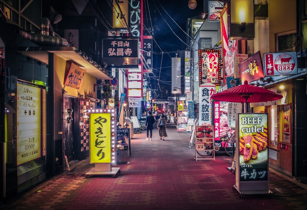 a city street filled with lots of neon signs