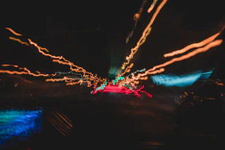 a blurry photo of a city street at night