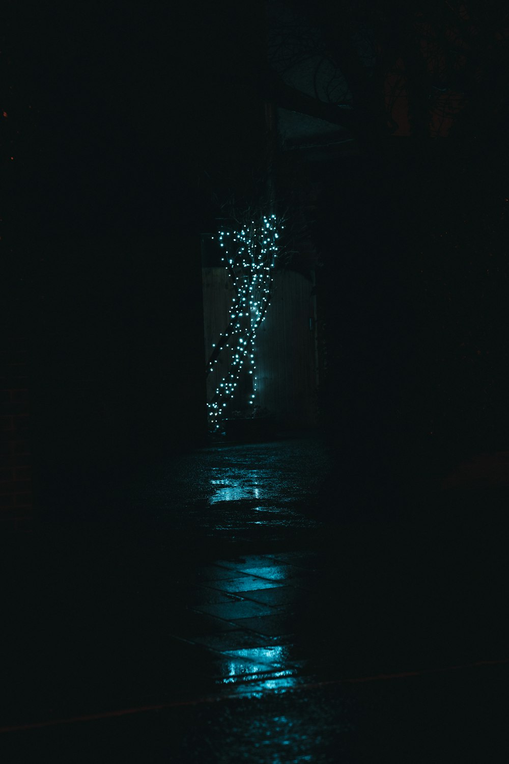 a street at night with lights on the side of it