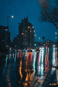 a city street filled with lots of traffic at night