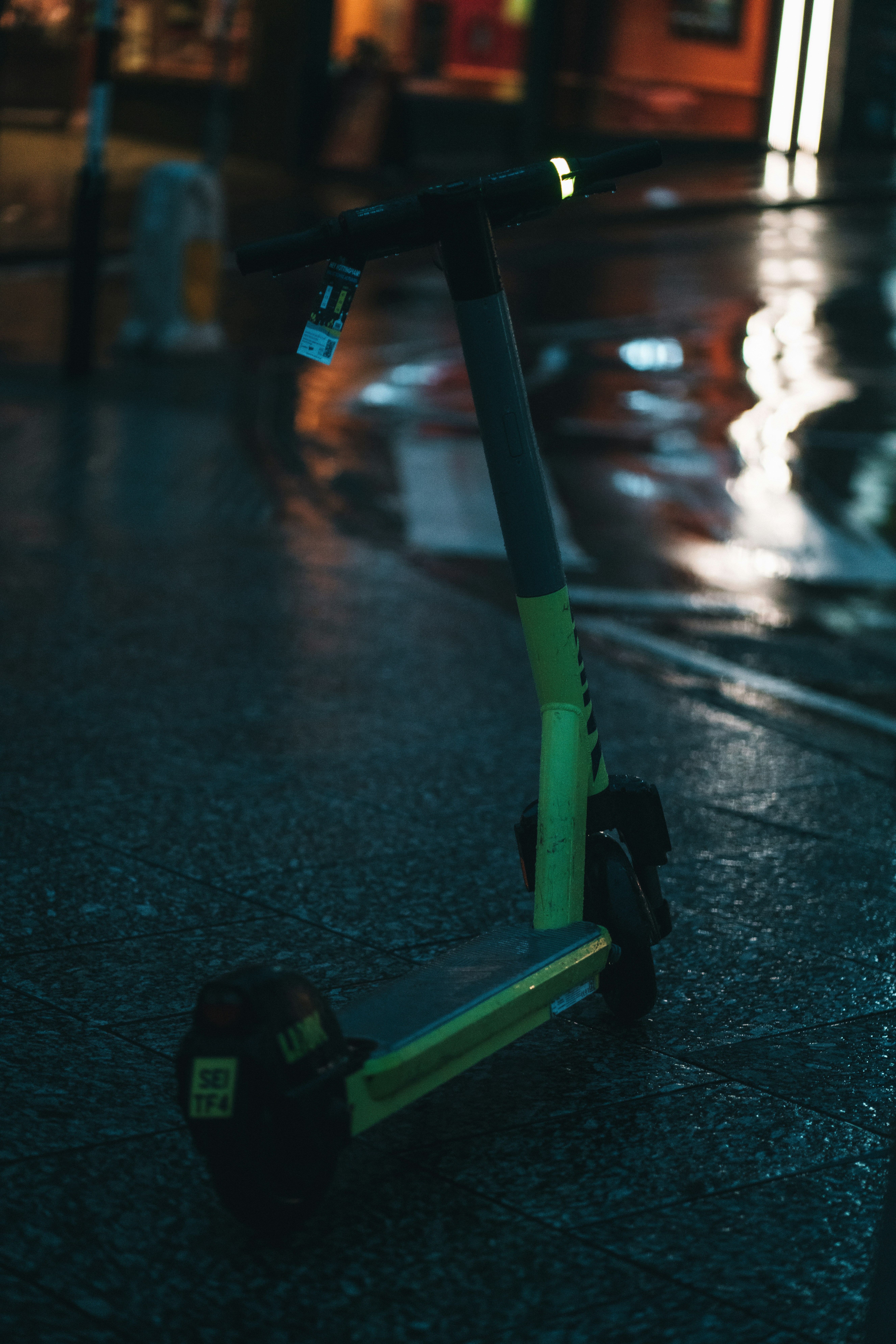 Honda PCX160 scooter in urban night setting, neon city lights reflection, modern design