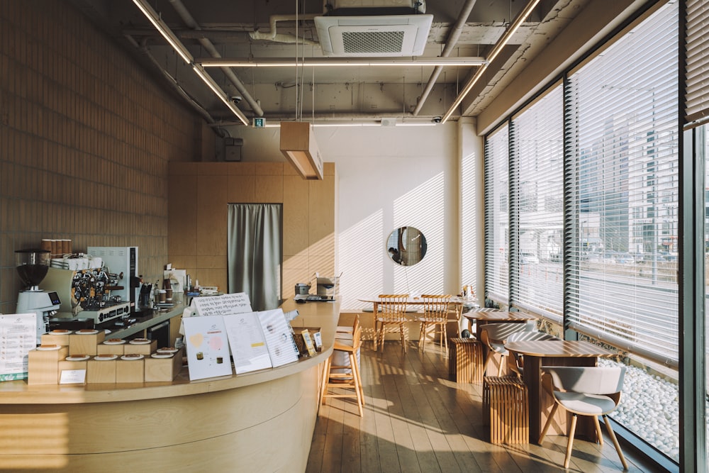 a restaurant with wooden tables and wooden chairs