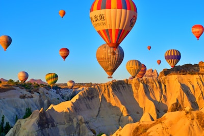 a group of hot air balloons flying in the sky