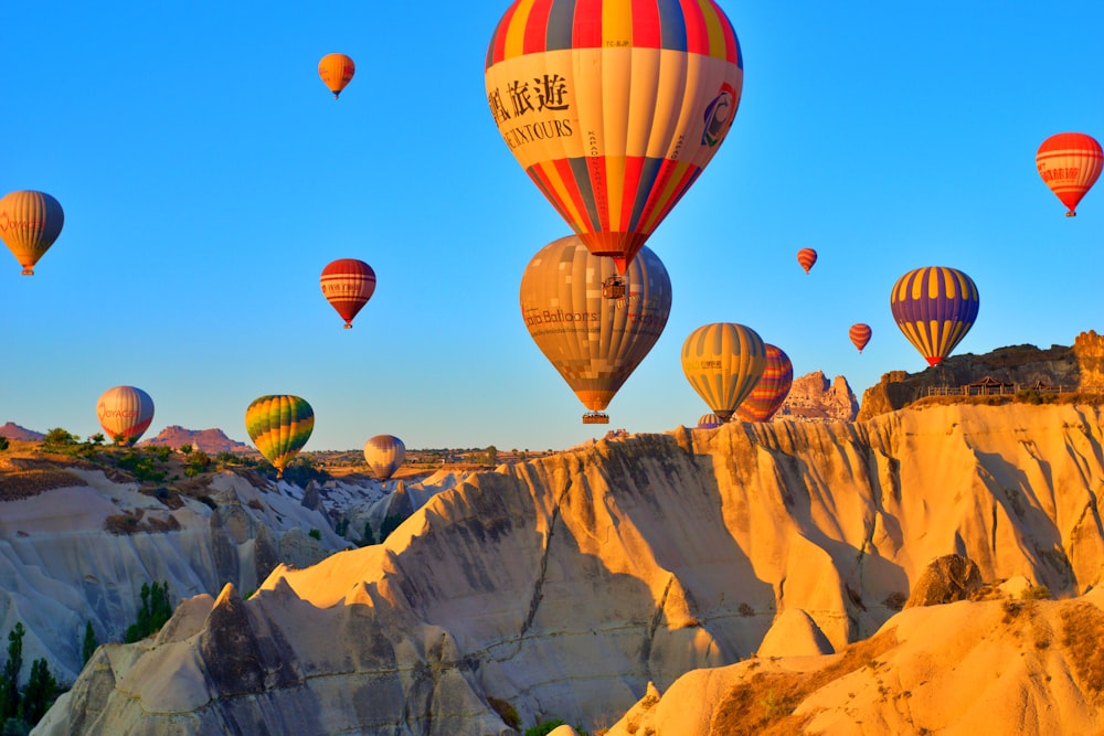 a group of hot air balloons flying in the sky