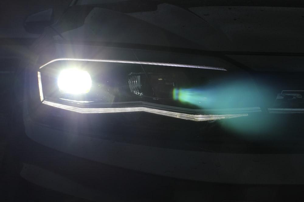 a close up of a headlight on a car