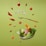 Floating food items including cherry tomatoes, almonds, cashews, slices of red bell pepper, cheese cubes, lettuce, and ham. A fork is levitating among these ingredients. The letters spelling 'DIET' are arranged with small tiles like a game. The background is a solid light green color.