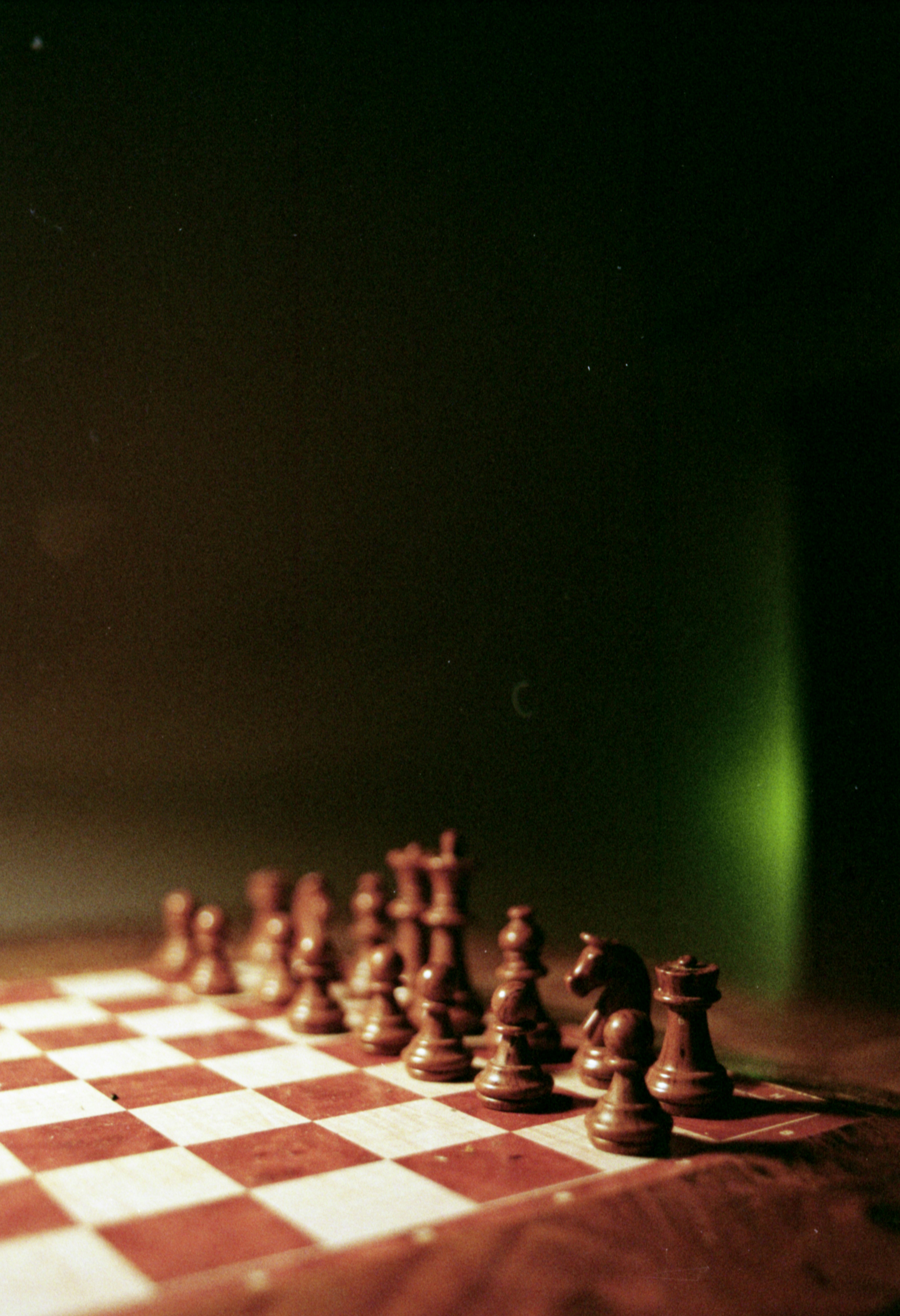 a group of chess pieces sitting on top of a chess board