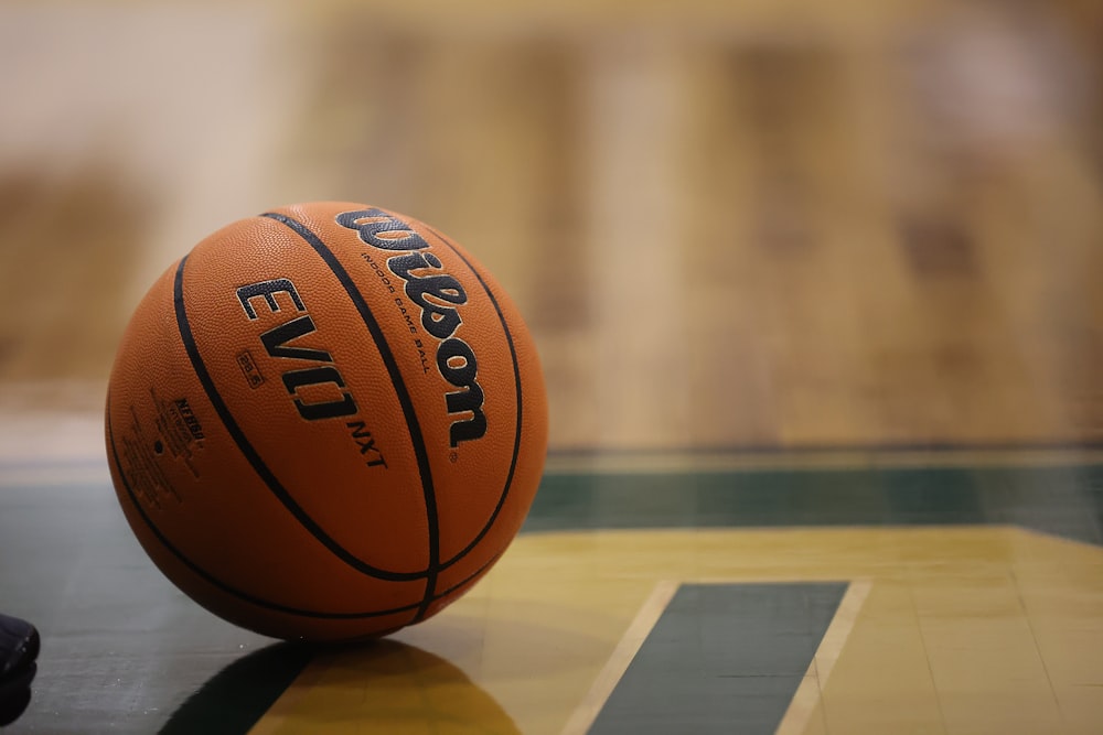 a close up of a basketball on a basketball court