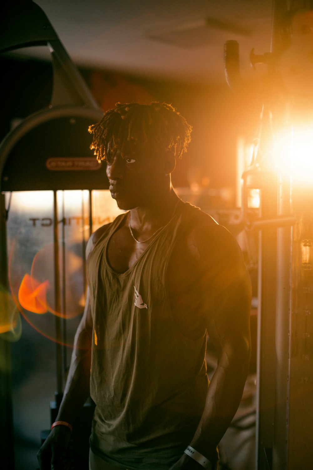 a man standing in front of a light in a room