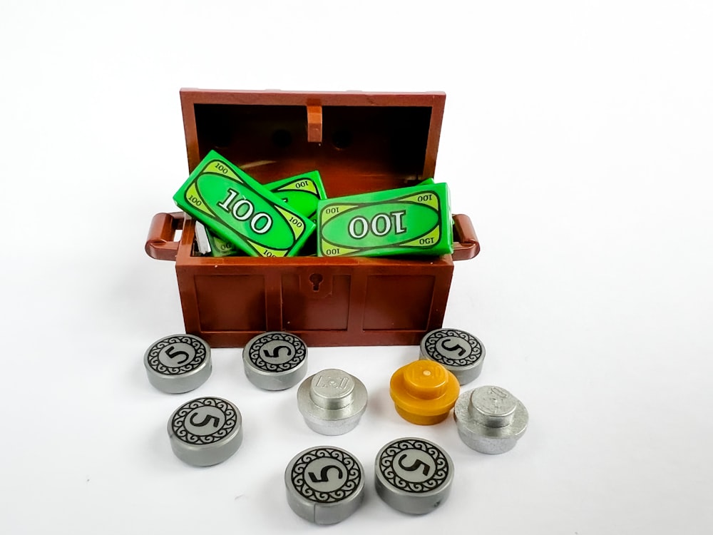 a wooden box filled with lots of green items