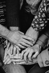 a group of people holding hands together