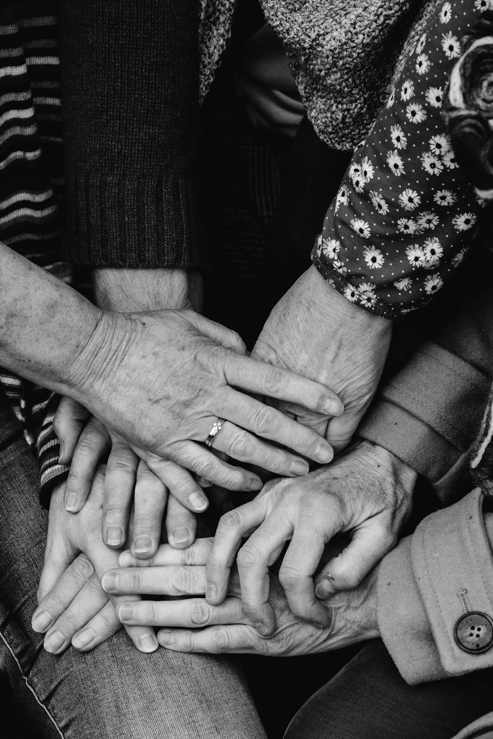 a group of people holding hands together