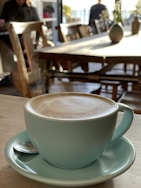 Close-up of a specialty coffee cup on a wooden table inside ritorno.