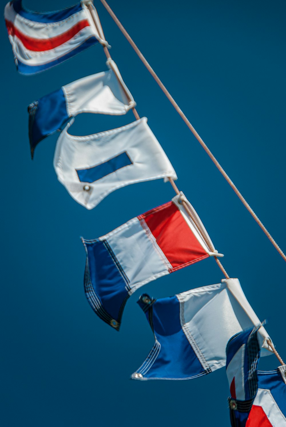 a group of flags that are flying in the air