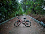 Mountain bike resting beside a small rustic pousada in a quiet Brazilian village.