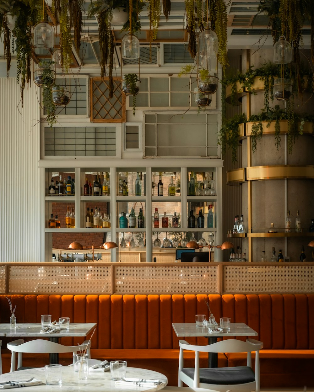 a restaurant filled with lots of tables and chairs