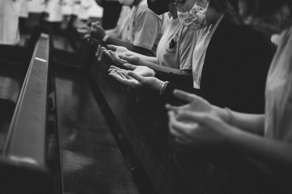 a group of people sitting at a bar