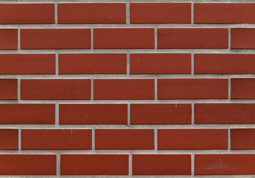 a close up of a red brick wall