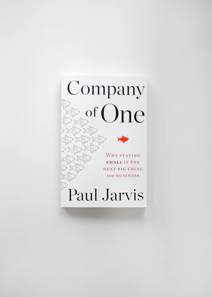 A blue paperback novel photographed flat on a neutral surface