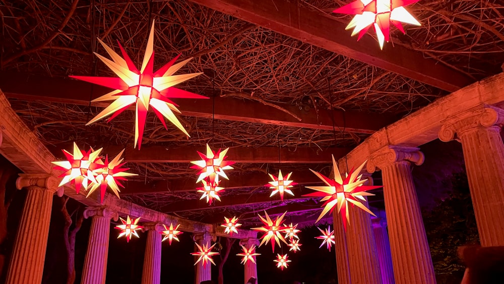 a group of stars hanging from the ceiling of a building