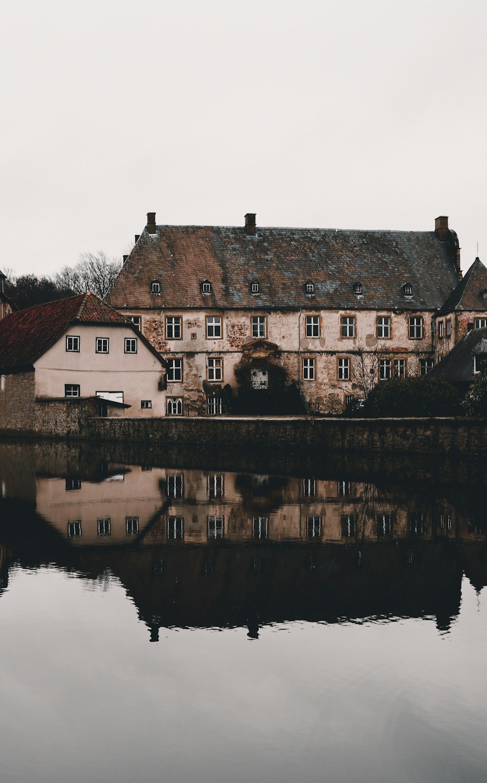 a large building sitting next to a body of water