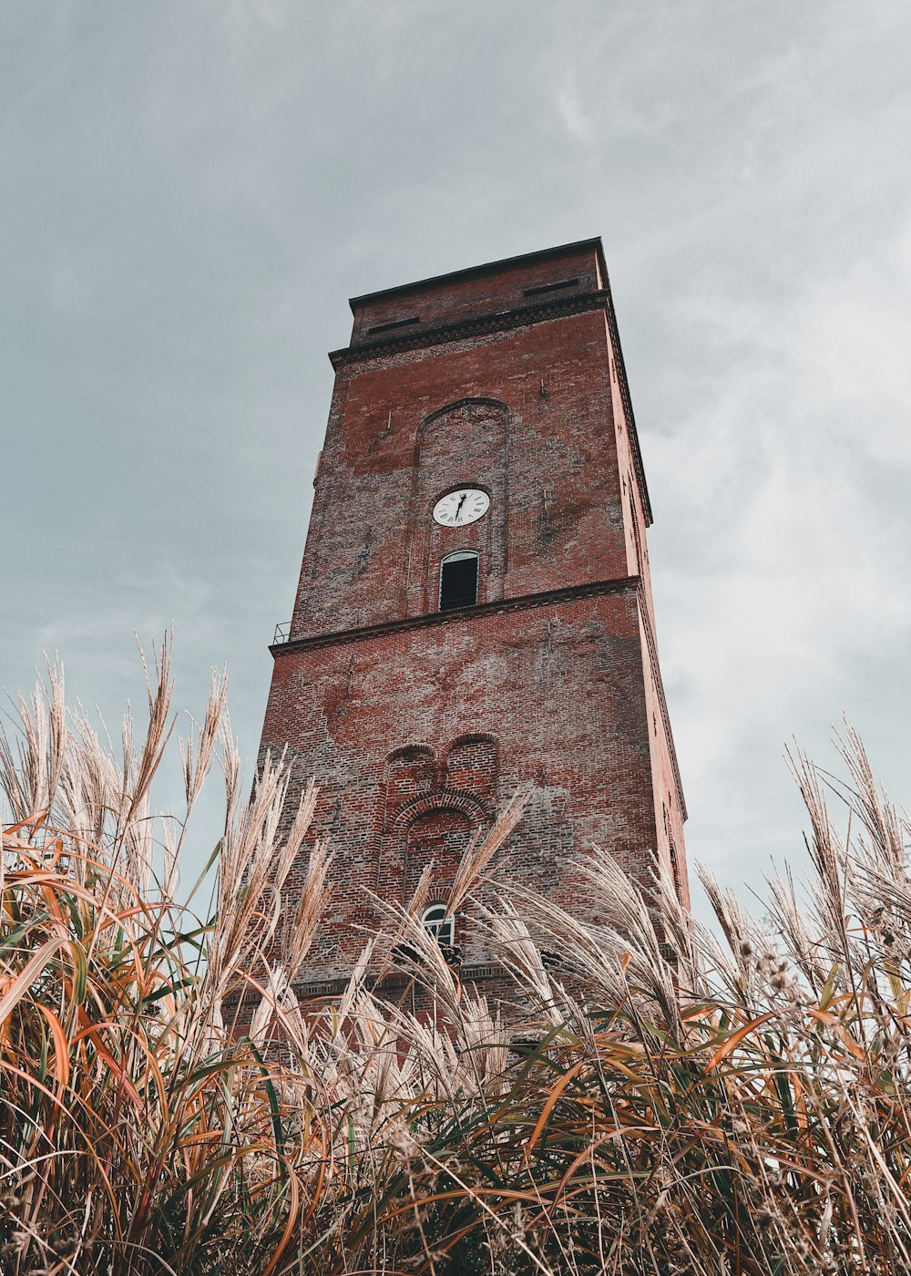 a tall brick tower with a clock on it