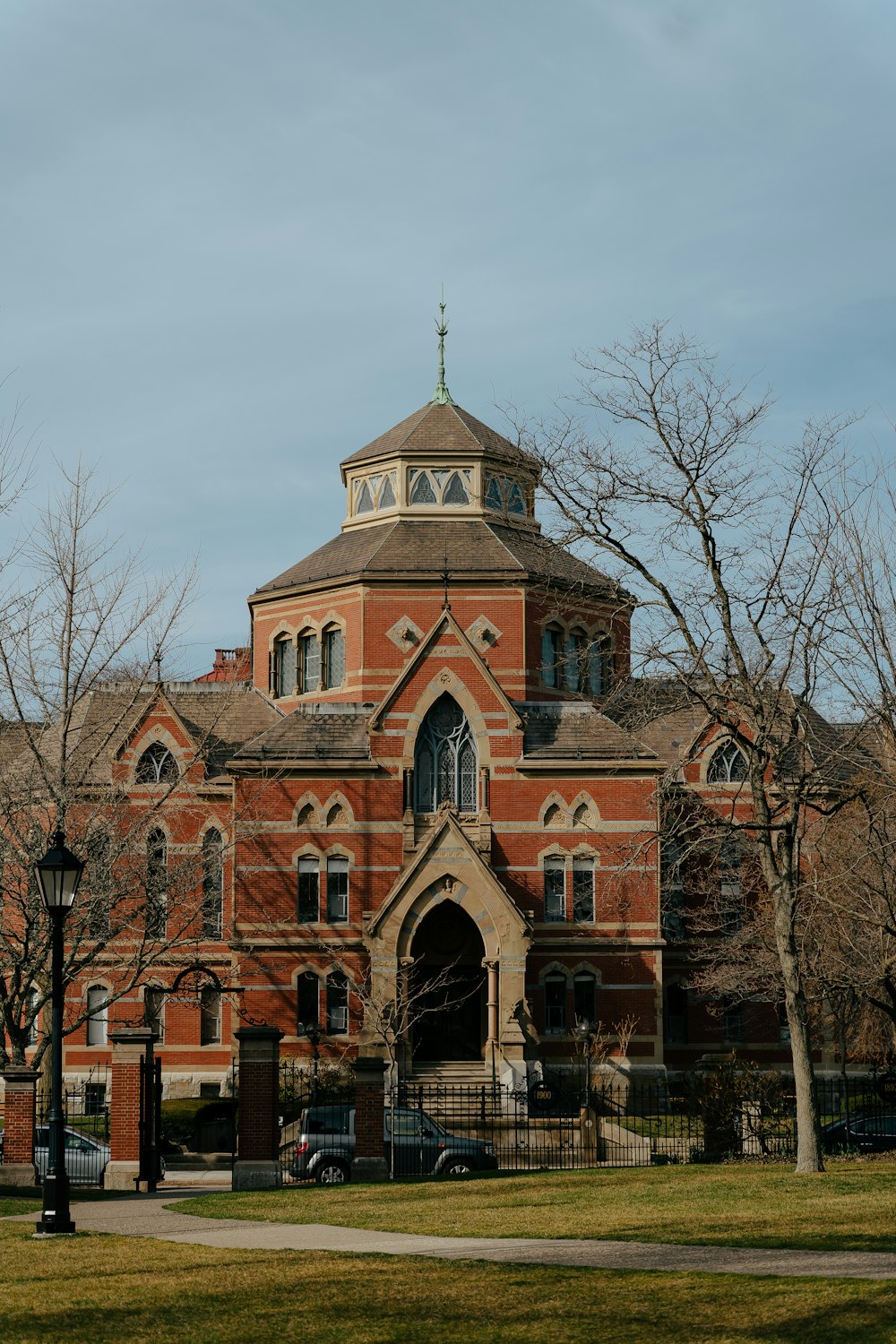 a large red brick building with a clock tower