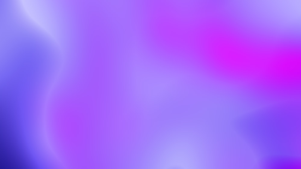 a blurry image of a pink and purple background