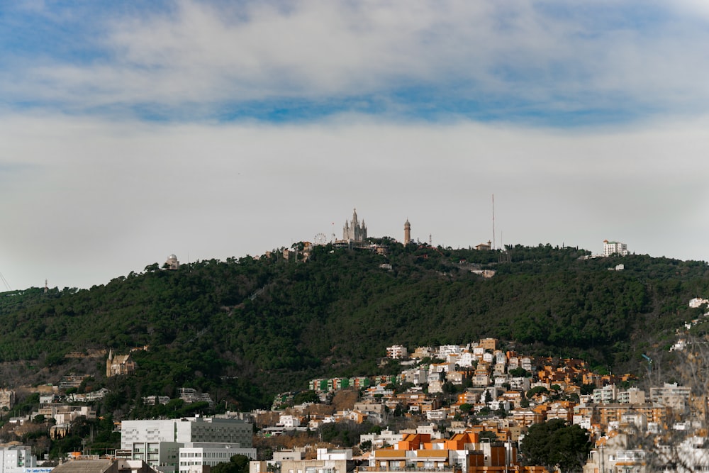 a view of a city with a hill in the background