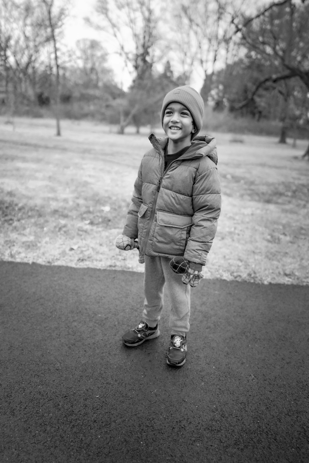 a little boy that is standing in the dirt