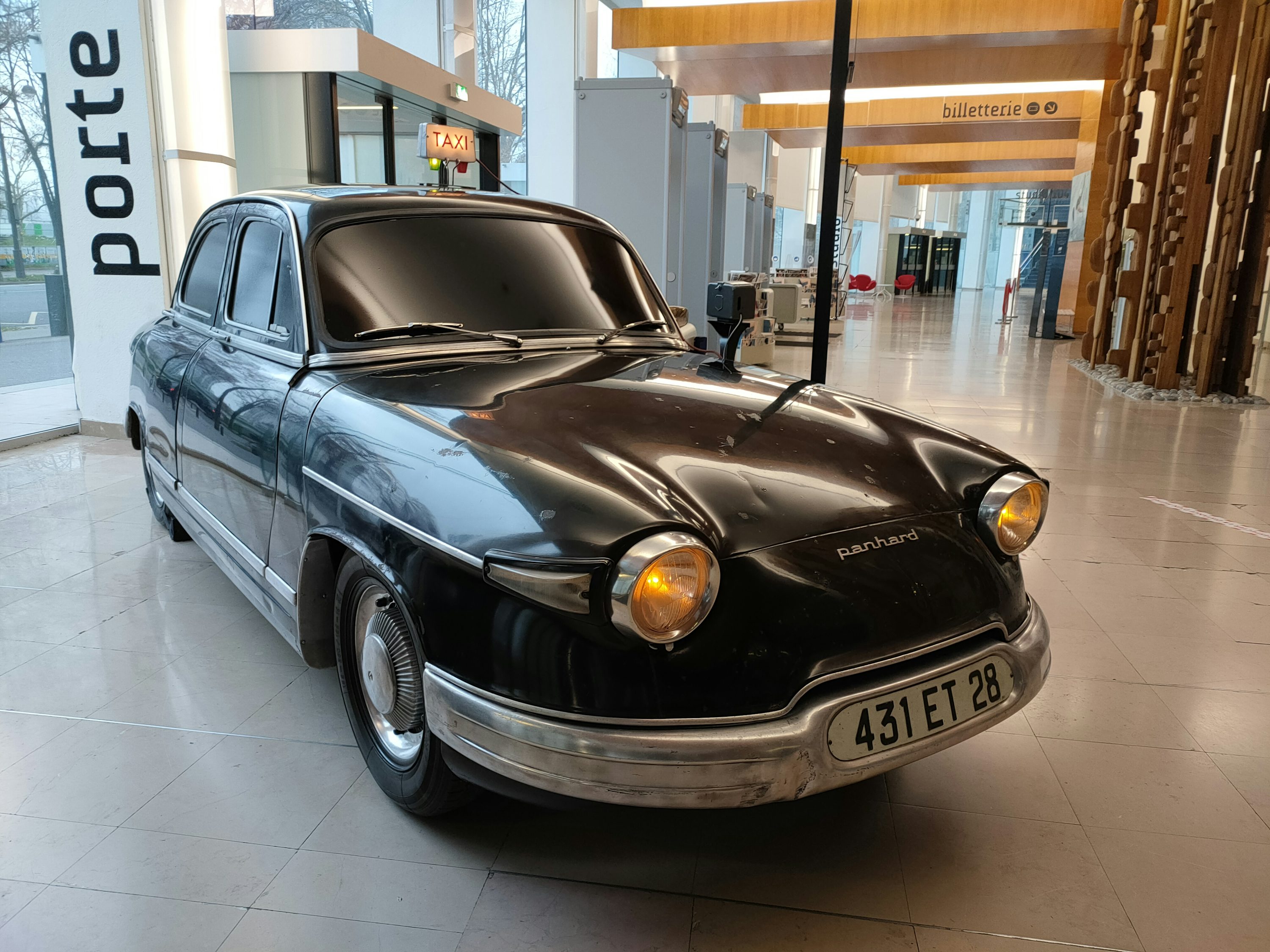 a black car parked inside of a building