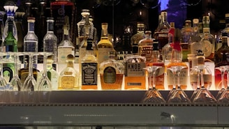 a bunch of bottles that are sitting on a shelf