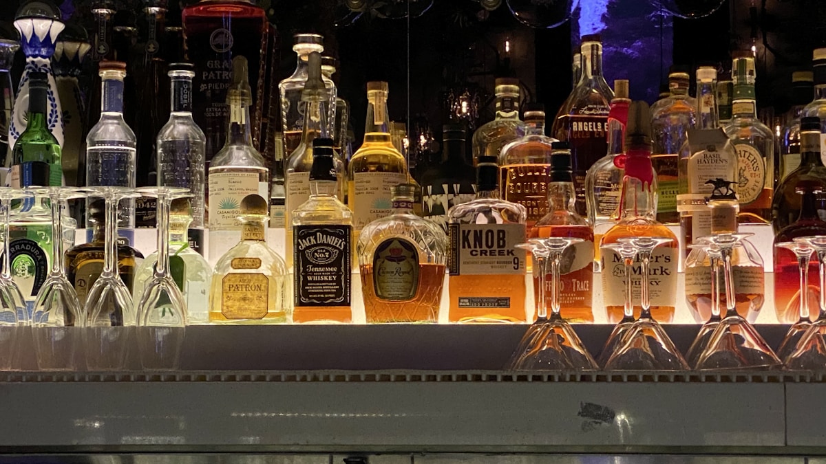 a bunch of bottles that are sitting on a shelf