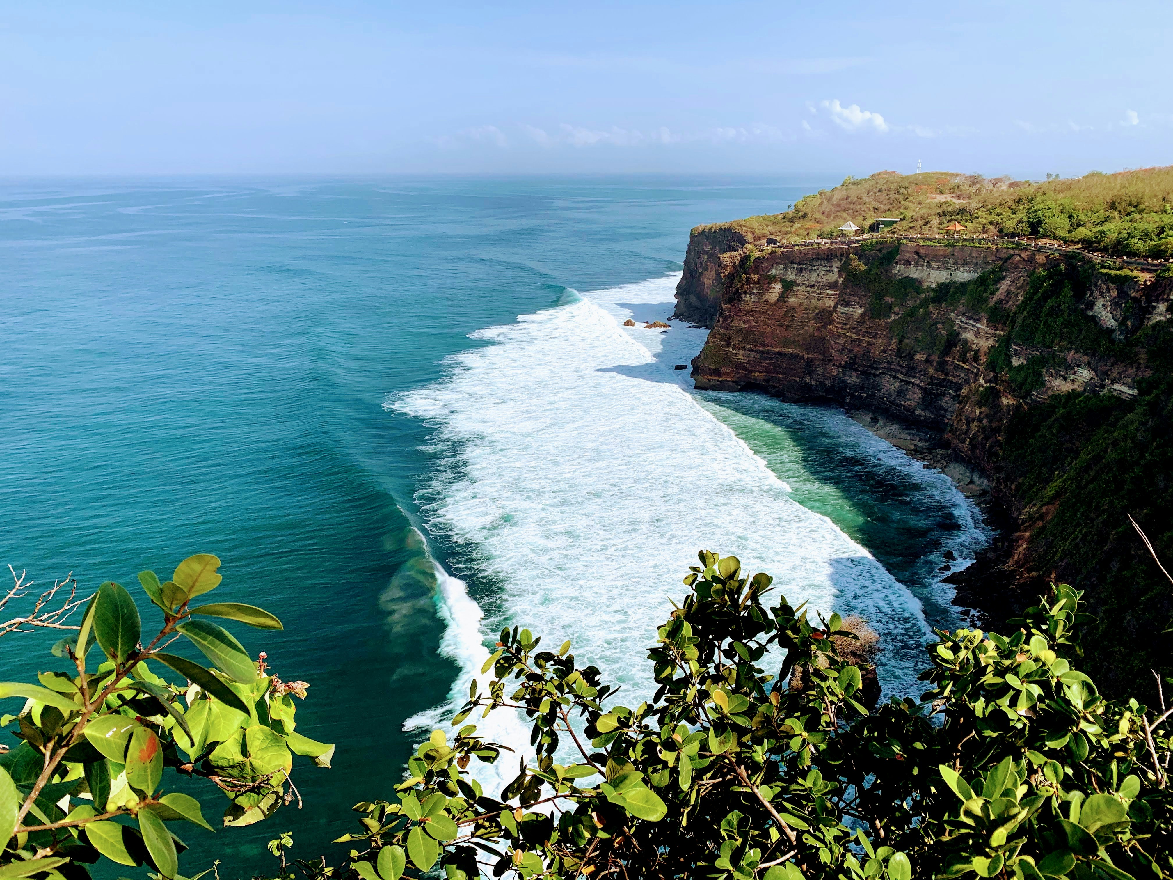 a view of the ocean from the top of a cliff