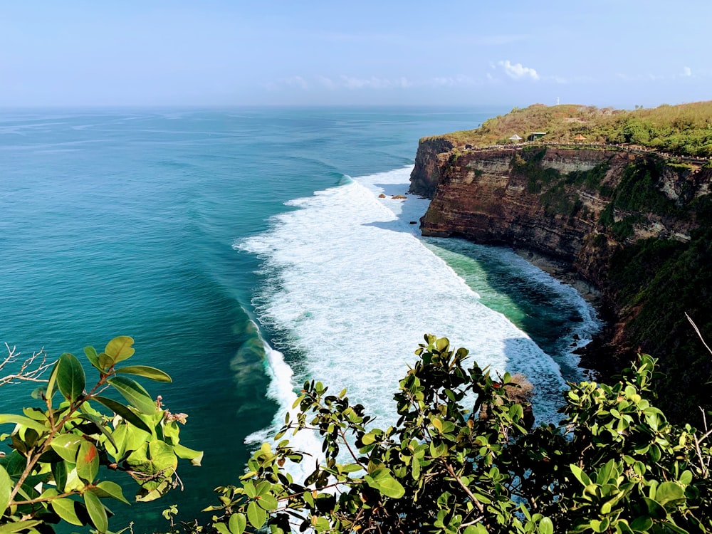 a view of the ocean from the top of a cliff