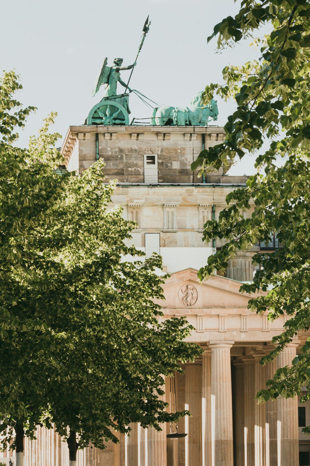 a tall building with a statue on top of it