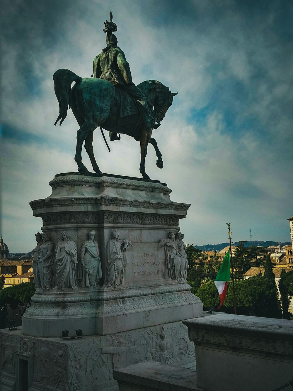 a statue of a man riding on the back of a horse