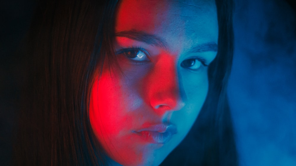 a woman with a red light on her face