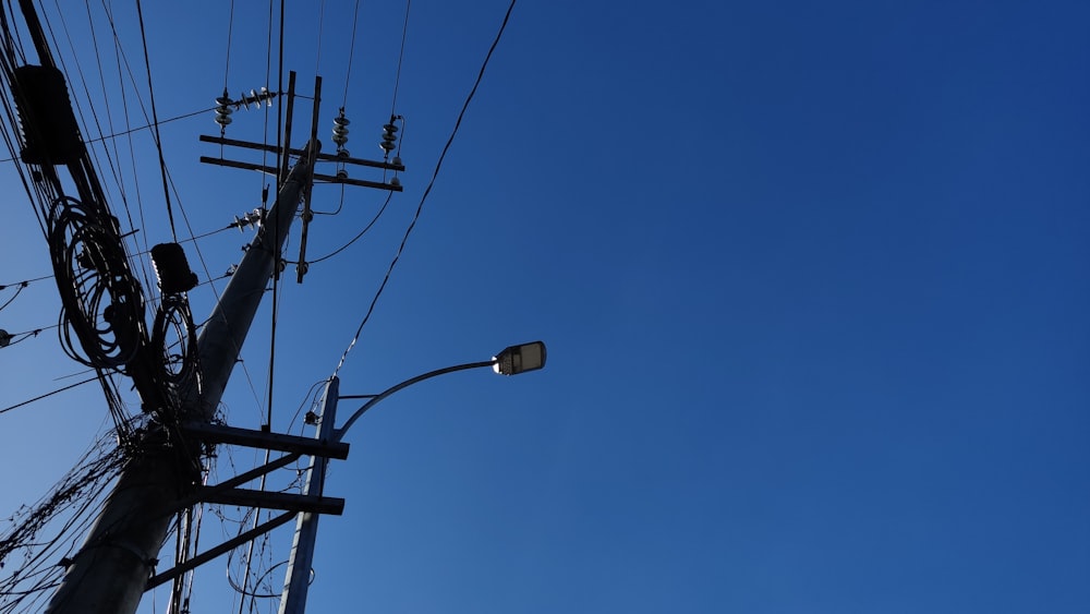 a street light sitting next to a telephone pole