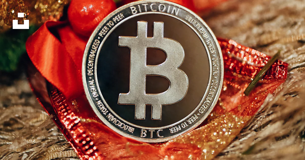 A bitcoin coin sitting on top of a red ribbon photo – Free Trading ...