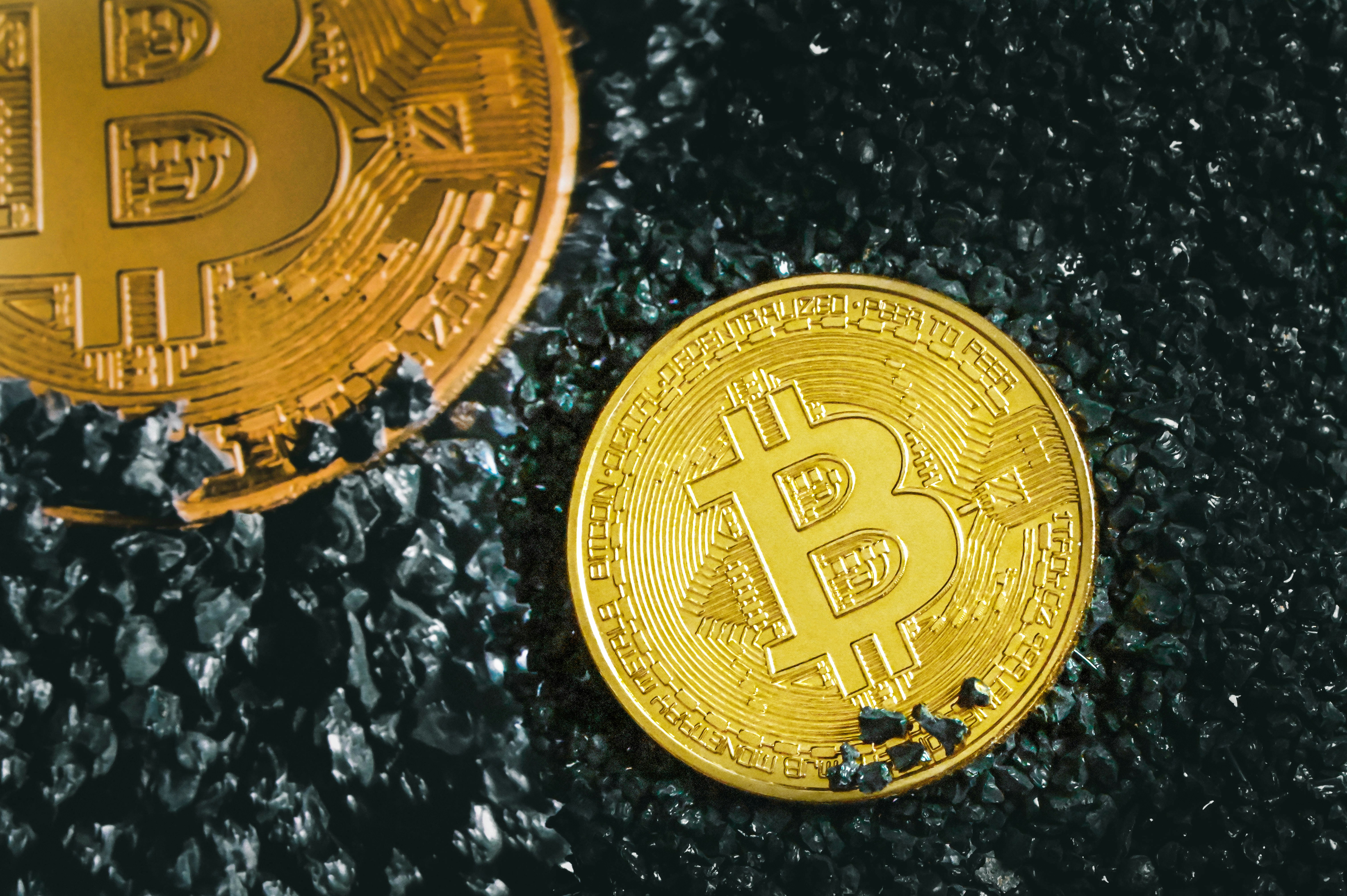 Two Bitcoins placed on black stones