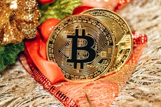 a bitcoin sitting on top of a red ribbon