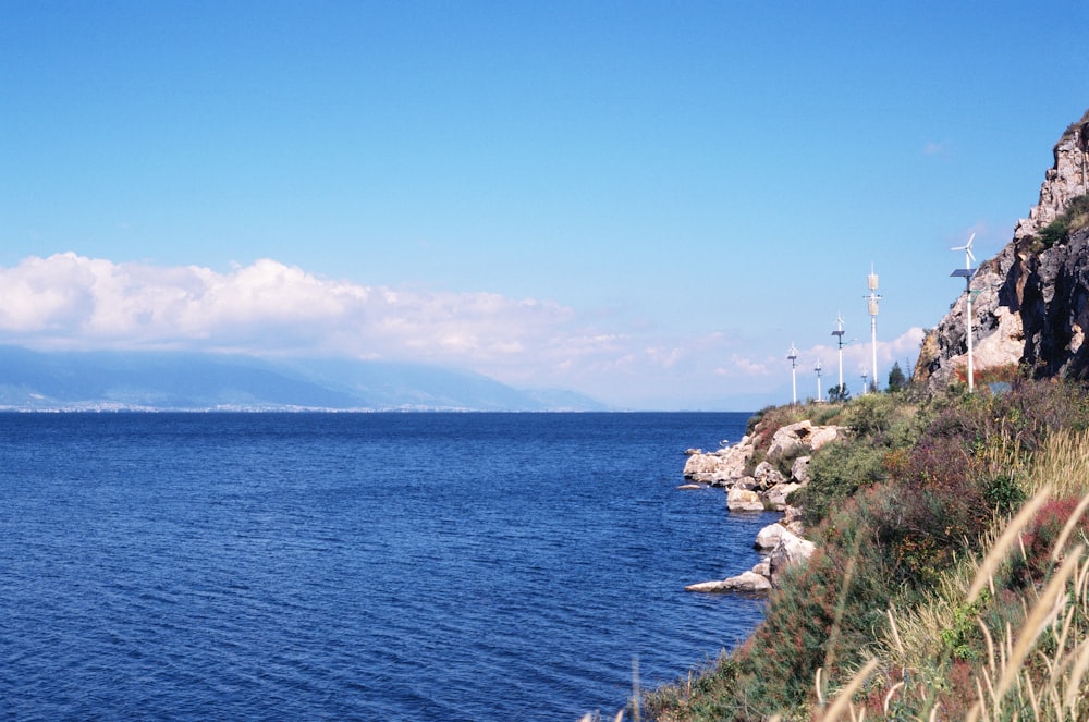 a body of water with a mountain in the background