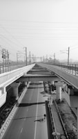 a black and white photo of an empty highway