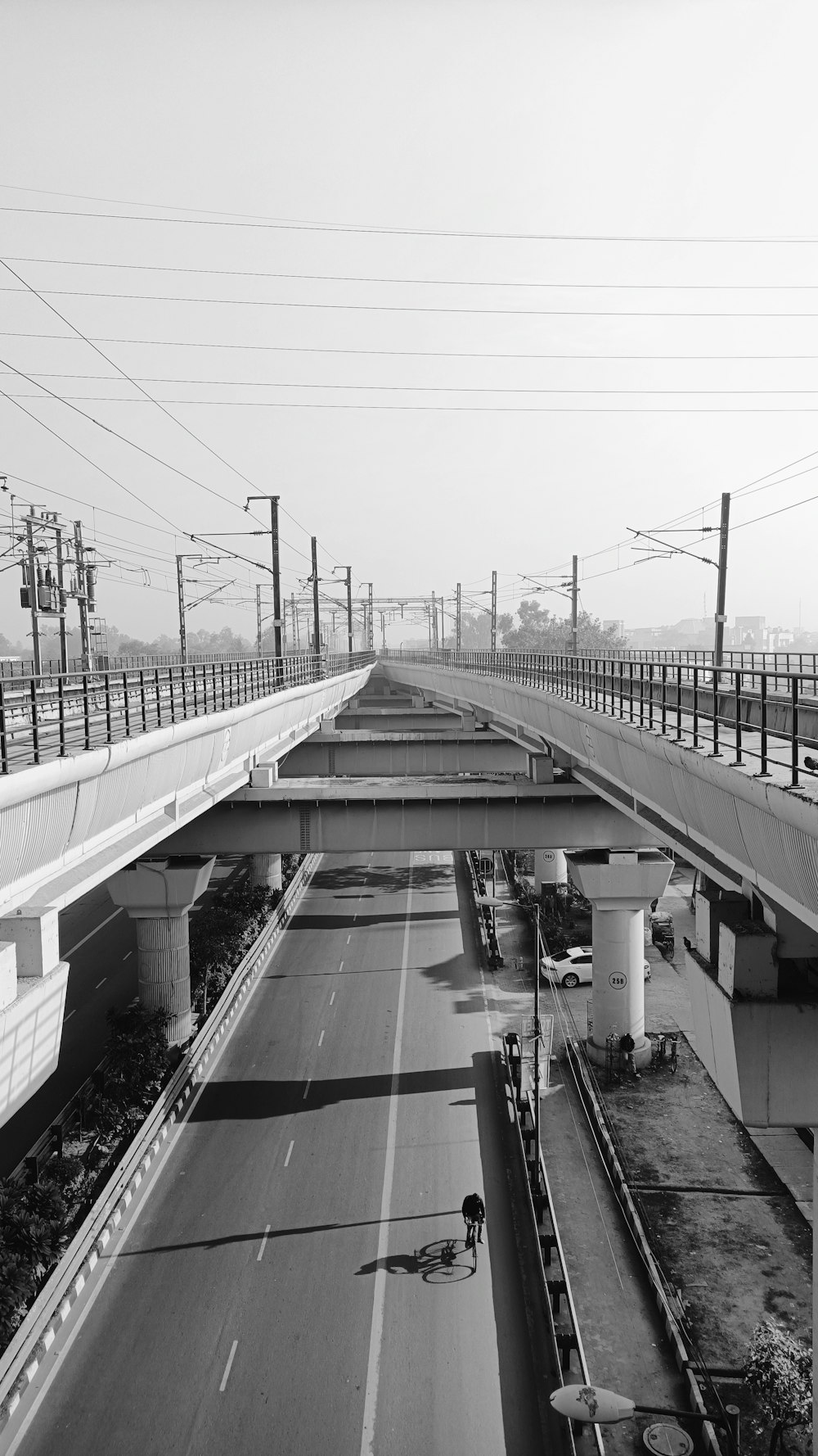 a black and white photo of an empty highway