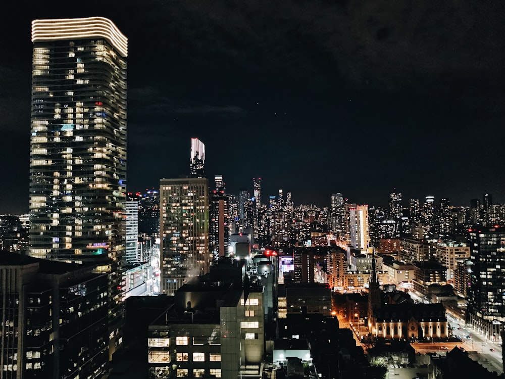 a view of a city at night from the top of a building