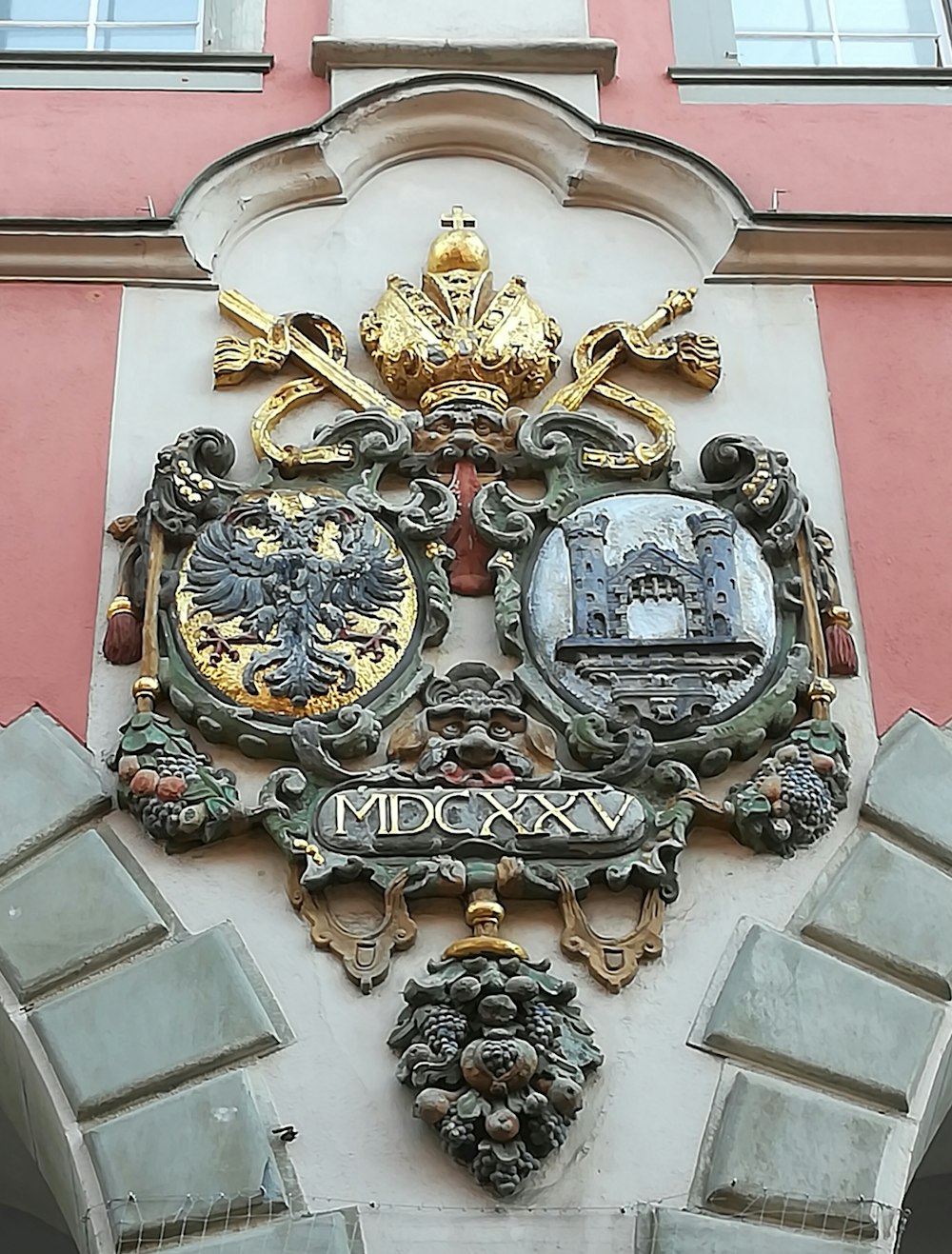 a large coat of arms on the side of a building